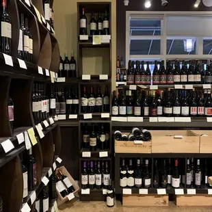 a large selection of wine bottles