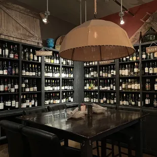 a table and chairs in a wine cellar