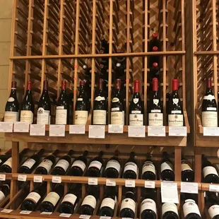 a wine rack full of wine bottles