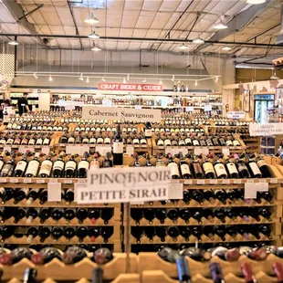 rows of bottles of wine in a store