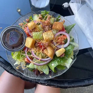 a plate of salad on a table