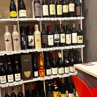 a shelf full of wine bottles