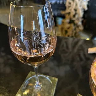 a glass of wine on a table