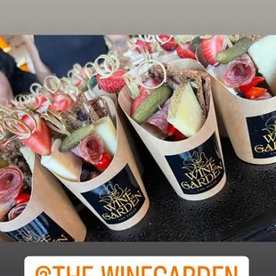 a display of wine and snacks