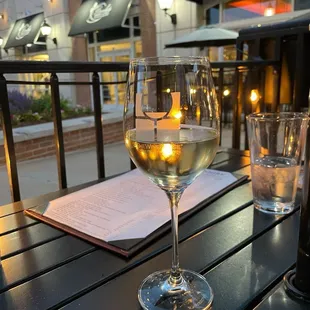 a glass of wine on a table