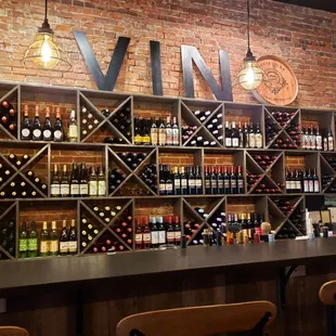 Behind the bar. So beautiful! You can buy wines to go too.