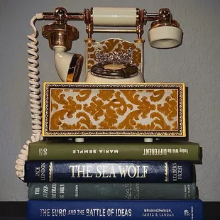 a phone on top of a stack of books