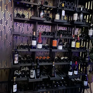 a wine rack full of wine bottles