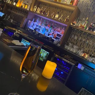 a glass of wine on the bar