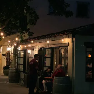 people sitting outside at night