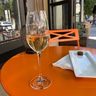 a glass of wine on a table