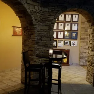 a table and chairs in front of a window