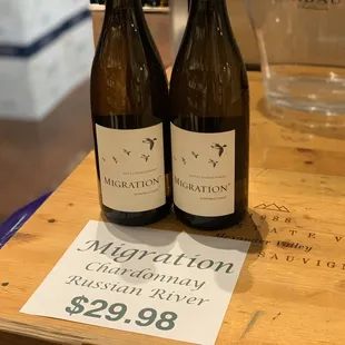 two bottles of wine on a table