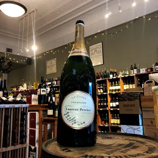 a bottle of wine on a barrel