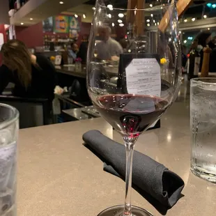 a glass of wine on a table