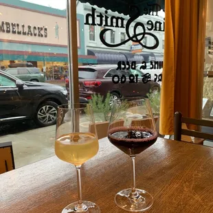 two glasses of wine on a table