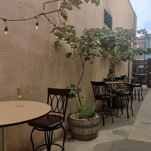 a patio with tables and chairs