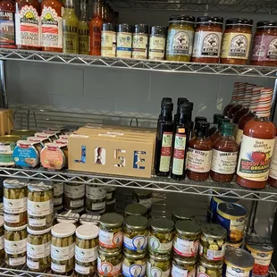 a shelf full of canned food