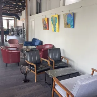 a row of chairs in a wine cellar