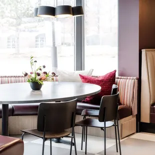 a dining room with a table and chairs