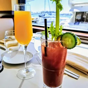 Double fisting a mimosa and bloody mary