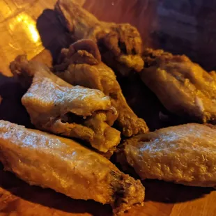 a plate of fried chicken wings