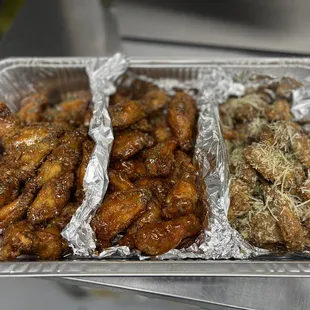 three trays of chicken wings