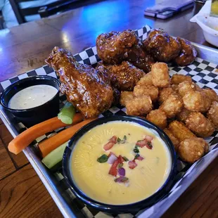Breaded wing drummets, tots, and a side of queso