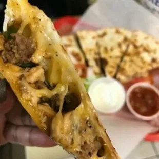 Chicken or Beef Quesadillas served with sour cream and salsa on the side.