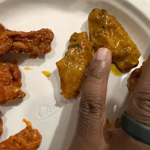 a plate of chicken wings