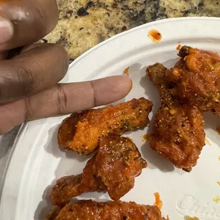 a plate of chicken wings