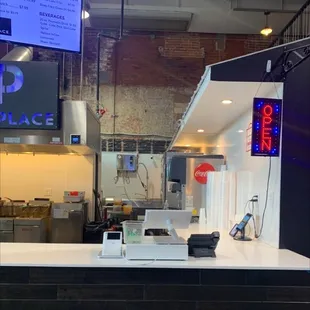 the kitchen counter and the open sign