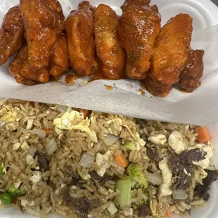 chicken wings and rice in a styrofoam container