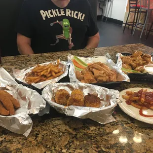 a man sitting at a table full of food