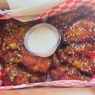 a box of chicken wings with sauce