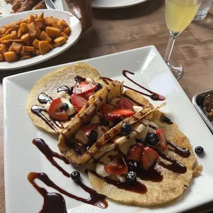 Pancake Tacos, home fries, bacon and Bedrock French Toast