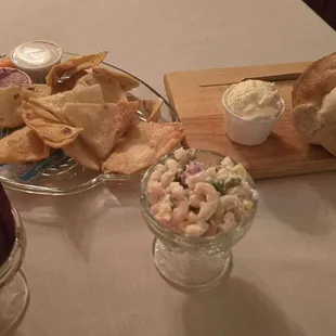Relish tray, loaf of bread, pickled beets, and pasta salad
