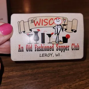 When checking in with the hostess, they give you a playing card.  This is your calling card to be seated