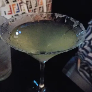 a glass of green liquid