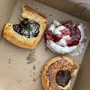 Top right clockwise: Eggplant black garlic miso danish, chocolate cinnamon roll w/ raspberry, and smoked chocolate danish