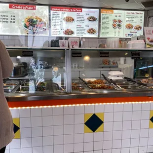 a woman standing in front of a buffet
