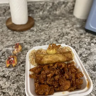 Orange Chicken Dinner Combo, comes with 3 crab puffs just put one in this pic... to die for, so delicious.