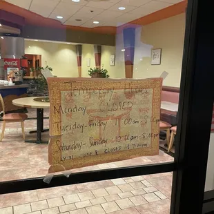 a sign in the window of a restaurant