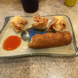 One egg roll and three crab puffs