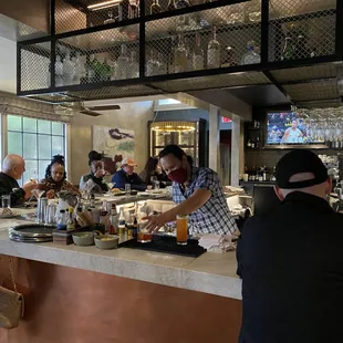 Busy bar, nicely laid out and accessorized.