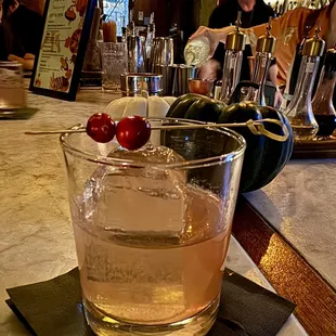 a drink in a glass on a bar