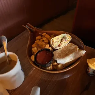a plate of food and a cup of coffee