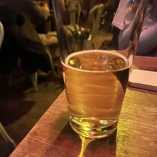 a glass of beer on a table