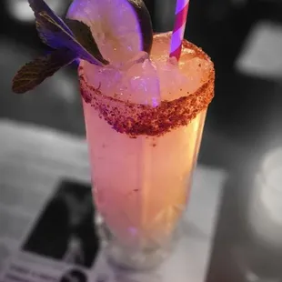 a drink in a glass with a straw