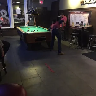 a man playing a game of pool